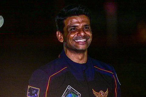 SpaceX Falcon 9 crew member Shubhanshu Shukla of ISRO, waves before departing to pad 39A for a launch to the International Space Station at the Kennedy Space Center in Cape Canaveral, Fla., Tuesday, June 24, 2025.