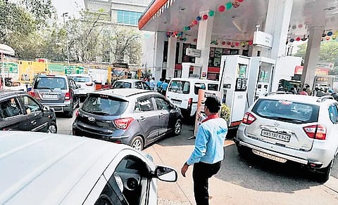 Vehicles lined up at a fuel bunk in Delhi.