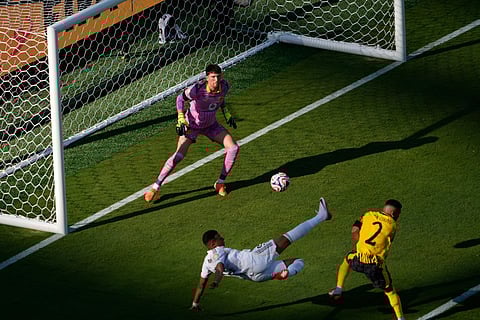 PSG's Ousmane Dembele (R) celebrates scoring his team's second goal with Desire Doue during the FIFA Club World Cup 2025 semifinal football match between PSG and Real Madrid on July 9, 2025. 