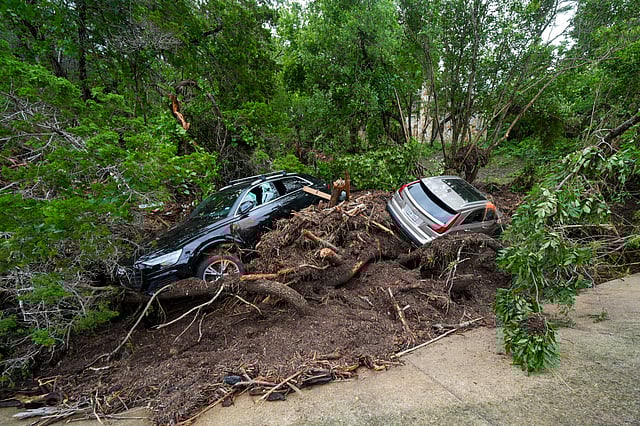 Vehicles are seen after they were washed away along the Guadalupe River after a flash flood swept through the area Saturday, July 5, 2025, in Hunt, Texas. 