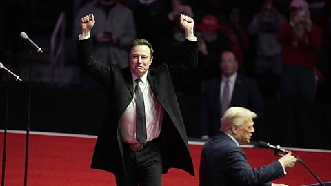 Elon Musk reacts as President-elect Donald Trump speaks at a rally ahead of the 60th Presidential Inauguration, Jan. 19, 2025, in Washington