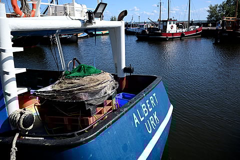This photograph shows fishing boats moored at the harbour in Urk, on July 3, 2025.