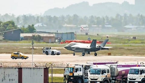 British Royal Navy fighter jet F-35B being towed to hangar at Thiruvananthapuram airport. Inset: UK’s Atlas ZM417 that brought aviation engineers and equipment. 