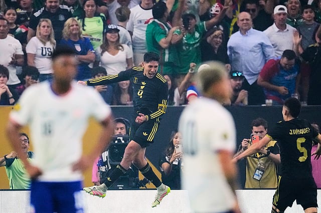 Mexico midfielder Edson Álvarez (4) leaps as he celebrates after scoring against the United States as Johan Vásquez (5) looks on in the second half of the CONCACAF Gold Cup final soccer match in Houston, Sunday, July 6, 2025.