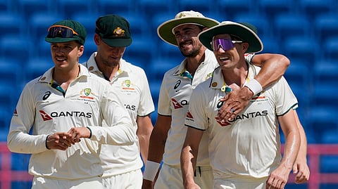 Australia's Mitchell Starc embraces captain Pat Cummins, right, after defeating West Indies on day four of the second cricket Test match at the National Cricket Stadium in St. George's, Grenada, Sunday, July 6, 2025.