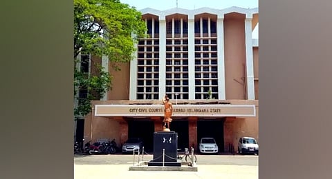 A bomb squad personnel conducts a search at the City Civil Court premises in Hyderabad on Tuesday. The threat later turned out to be a hoax 