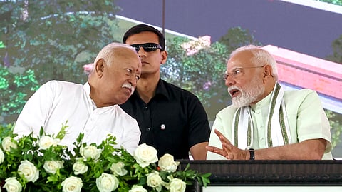 In this photo from March 30, 2025, RSS Chief Mohan Bhagwat (L) is seen speaking with Prime Minister Narendra Modi during an event in Nagpur.