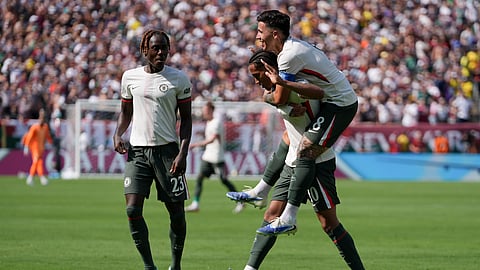 Chelsea's Joao Pedro celebrates with Enzo Fernandez, right, and Trevoh Chalobah, left, after scoring a goal against Fluminense during the second half of a Club World Cup semifinal soccer match in East Rutherford, N.J., Tuesday, July 8, 2025.