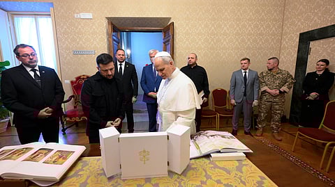 This handout photo taken and released on July 9, 2025 by The Vatican Media shows Pope Leo XIV meeting with Ukraine's President Volodymyr Zelensky at the papal residence of Castel Gandolfo, southeast of Rome. 