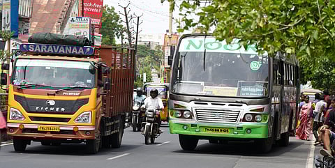 A private bus waiting at a stop in Tiruchy city, hindering traffic