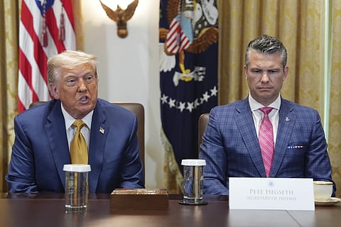 President Donald Trump, left, with Defense Secretary Pete Hegseth, right, during a cabinet meeting at the White House, Tuesday, July 8, 2025, in Washington. 
