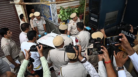 Police personnels at the spot where double murder of a woman and an infant took place at Civil Lines area, in New Delhi on Tuesday.