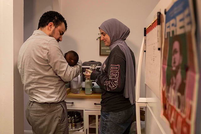 Pro-Palestinian activist Mahmoud Khalil and his wife, Dr. Noor Abdalla, hold their baby Deen during an interview, July 3, 2025, in New York.