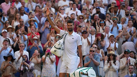 Serbia's Novak Djokovic leaves the court after losing to Italy's Jannik Sinner in a men's singles semifinal at the Wimbledon Tennis Championships in London, Friday, July 11, 2025.