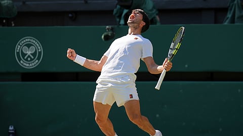 Spain's Carlos Alcaraz celebrates after beating Taylor Fritz of the US in the men's singles semifinal at the Wimbledon Tennis Championships in London, Friday, July 11, 2025.