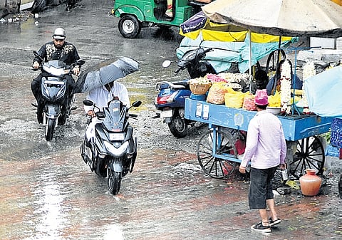 A sudden spell of rain in some parts of the city on Friday caught residents offguard 