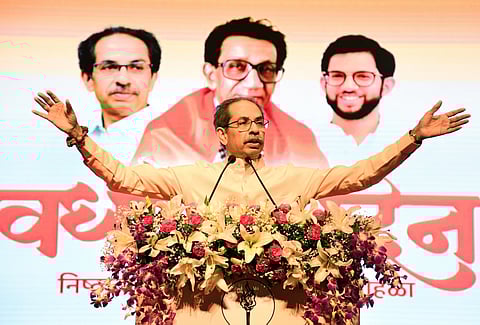 Shiv Sena (UBT) chief Uddhav Thackeray, left, and Maharashtra Navnirman Sena (MNS) chief Raj Thackeray release their alliance manifesto for the upcoming civic polls, at Sena Bhavan, in Mumbai, Sunday, Jan. 4, 2026.