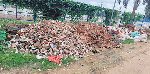 Heaps of construction waste lying along Taladanda canal road near Jobra 