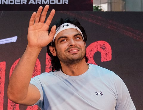Neeraj Chopra waves at the public at the launch of a sports store in Gurgaon on Friday.
