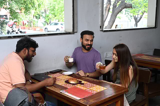 Customers enjoying a cup of tea at Irani Std Tea, HSR Layout