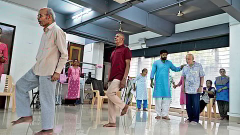 Hrishikesh Pawar (in blue kurta) helping the seniors