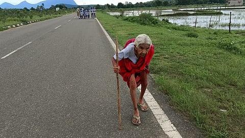 Mangalbari Mahara walking to receive her anti-rabies injection.