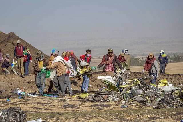 Rescuers work at the scene of an Ethiopian Airlines flight of a Boeing 737 Max 8 plane crash near Bishoftu, or Debre Zeit, south of Addis Ababa, Ethiopia, March 11, 2019. 