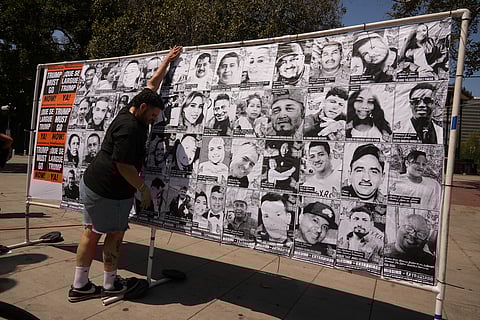 People shout at federal immigration agents during a raid in the agriculture area of Camarillo, Calif., July 10, 2025.