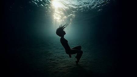 Officials said they drowned after slipping into deep sand pits while swimming. 