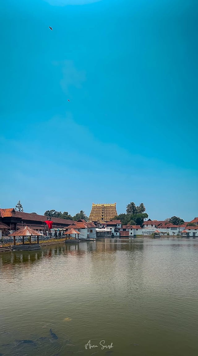 The age-old tank known as 'Padmatheertham' seen with the temple 'gopuram' in the backdrop.
