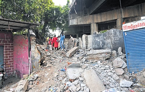 Left with no other option, pedestrians take a path filled with rocks next to the decrepit Fatehnagar RoB in Hyderabad 