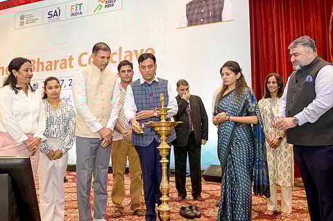 Mansukh Mandaviya lights the lamp before the Khelo Bharat Conclave in New Delhi on Thursday