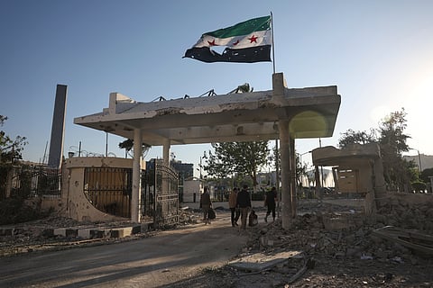 Bedouin fighters ride in a truck in Mazraa village on the outskirts of Sweida city, in southern Syria, Saturday, July 19, 2025.