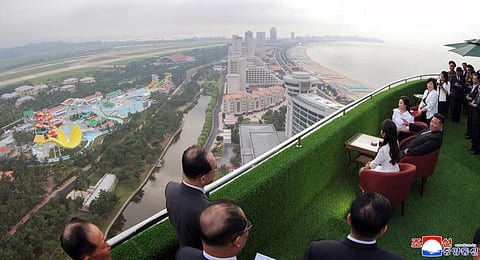 North Korean leader Kim Jong Un, sitting center, with his wife Ri Sol Ju, rear, and daughter tours the Wonsan-Kalma coastal tourist zone in North Korea on Tuesday, June 24, 2025.