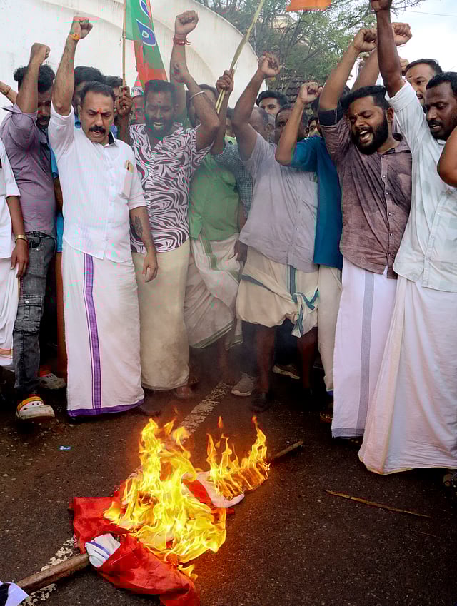 BJP activists protesting in front of Thevalakkara Boys High School following a student's death in Kollam on Thursday