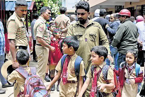 Students leave the St. Germain Academy premises near Coles Park after hoax bomb threat, in Bengaluru on Friday 