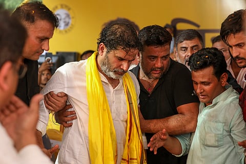 Jan Suraaj chief Prashant Kishore being assisted after an injury during the Bihar Badlav rally, in Arrah, Friday, July 18, 2025. 