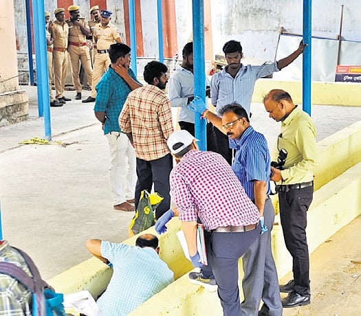 CBI officials overseeing a reenactment of the case on the temple premises 