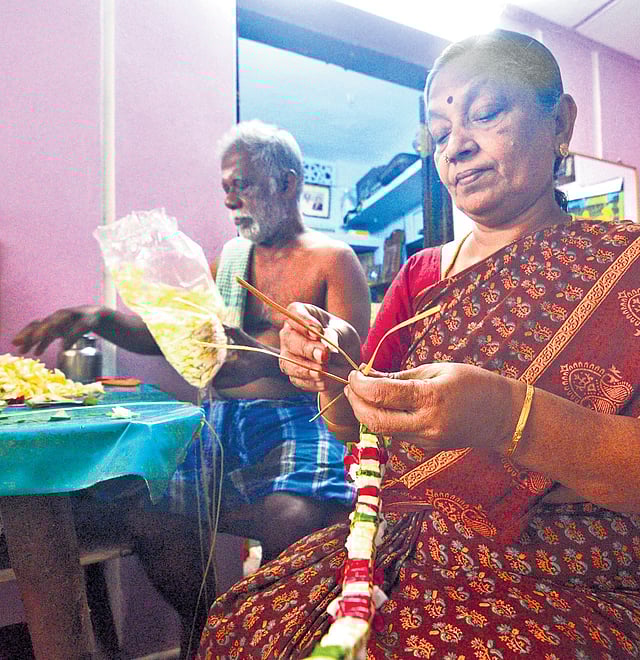 Vanitha’s parents crafting garland that has to be sent to Sree Padmanabhaswamy Temple in Kerala