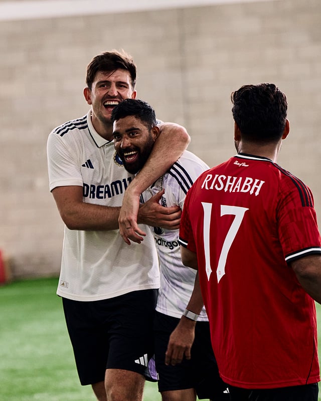 Mohammed Siraj and Harry Maguire share a joke