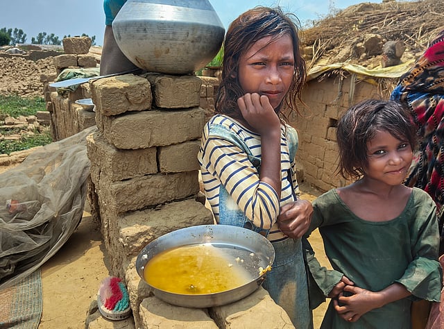Children who work with their families at a brick kiln, in Aligarh district, Uttar Pradesh, Wednesday, May 28, 2025.