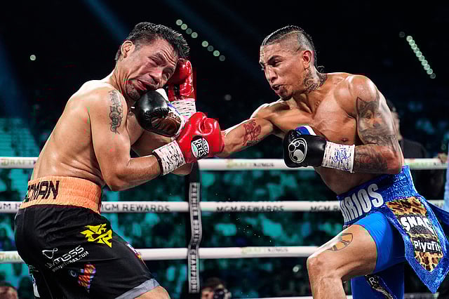 Manny Pacquiao, left, fights Mario Barrios in a welterweight title boxing match Saturday, July 19, 2025, in Las Vegas.