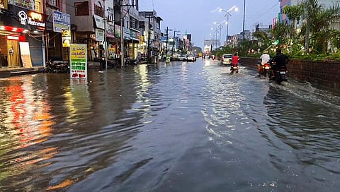 Following heavy rains, roads turn into streams as rainwater overflows from the drains within the Jangaon municipal limits on Saturday night.