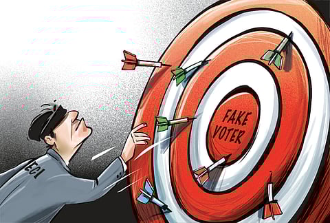 Voters show the enumeration forms given by a Booth Level Officer (BLO) during the ongoing Special Intensive Revision of electoral rolls in Vaishali district, Bihar