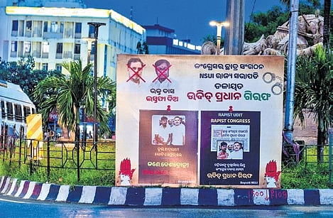 Posters put up along Janpath demanding resignation of OPCC chief Bhakta Charan Das, in Bhubaneswar on Tuesday