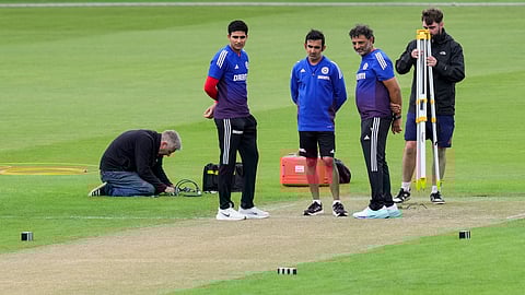 India head coach Gautam Gambhir, skipper Shubman Gill and batting coach Sitanshu Kotak inspecting the pitch at Old Trafford
