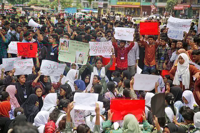 Students shout slogans during a protest near the site of the Monday crash of a Bangladesh air force training jet into a school, demanding accountability, compensation for victims' families and the halt of training flights, in Dhaka, Bangladesh, Tuesday, July 22, 2025. 