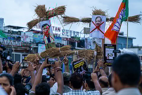 Bharatiya Janata Yuva Morcha take out a demonstration holding effigy of Rahul Gandhi and Bhakta Charan Das after the Youth Congress president arrested in alleged rape case, at Master Canteen Square in Bhubaneswar on Monday. 