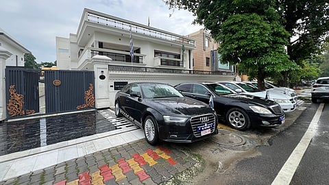 Cops seized four vehicles bearing fake diplomatic number plates, 12 forged diplomatic passports, and 34 rubber stamps of various countries, among other things.