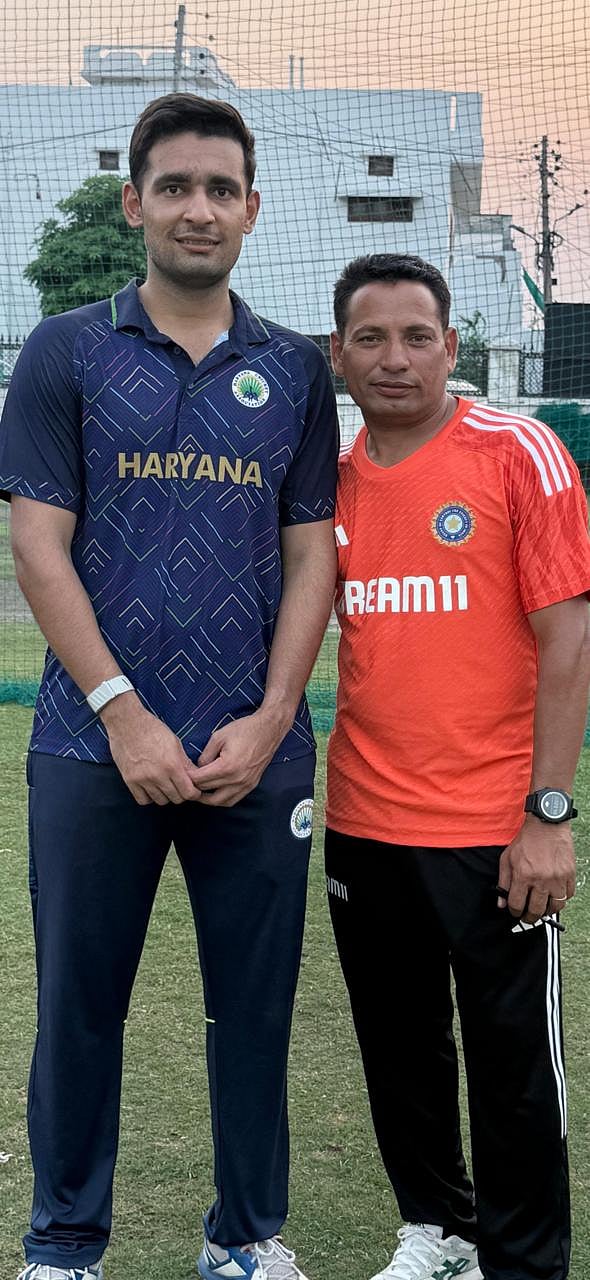Anshul Kamboj with his coach Satish Rana